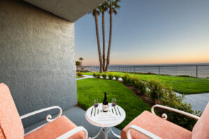Patio with chairs and wine at sunset
